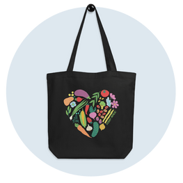 Ferry Morse vegetable heart tote bag on blue circular background.