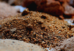 Small mounds of various soil types